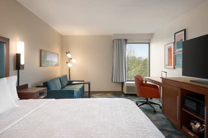 Photo of updated room with one king bed